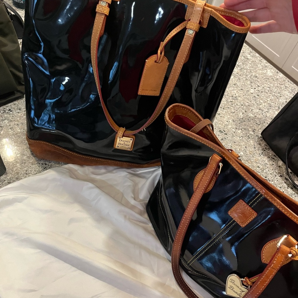 Set of black gloss Dooney and Bourke purses. Black purse set. Red interiors.